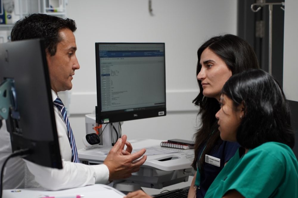Premier speaking with medical staff at Townsville University Hospital.